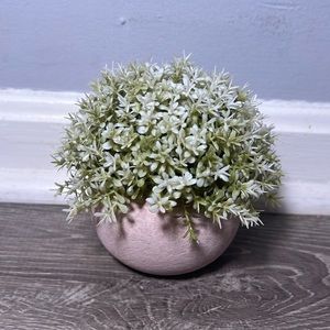 White fake plant in pot